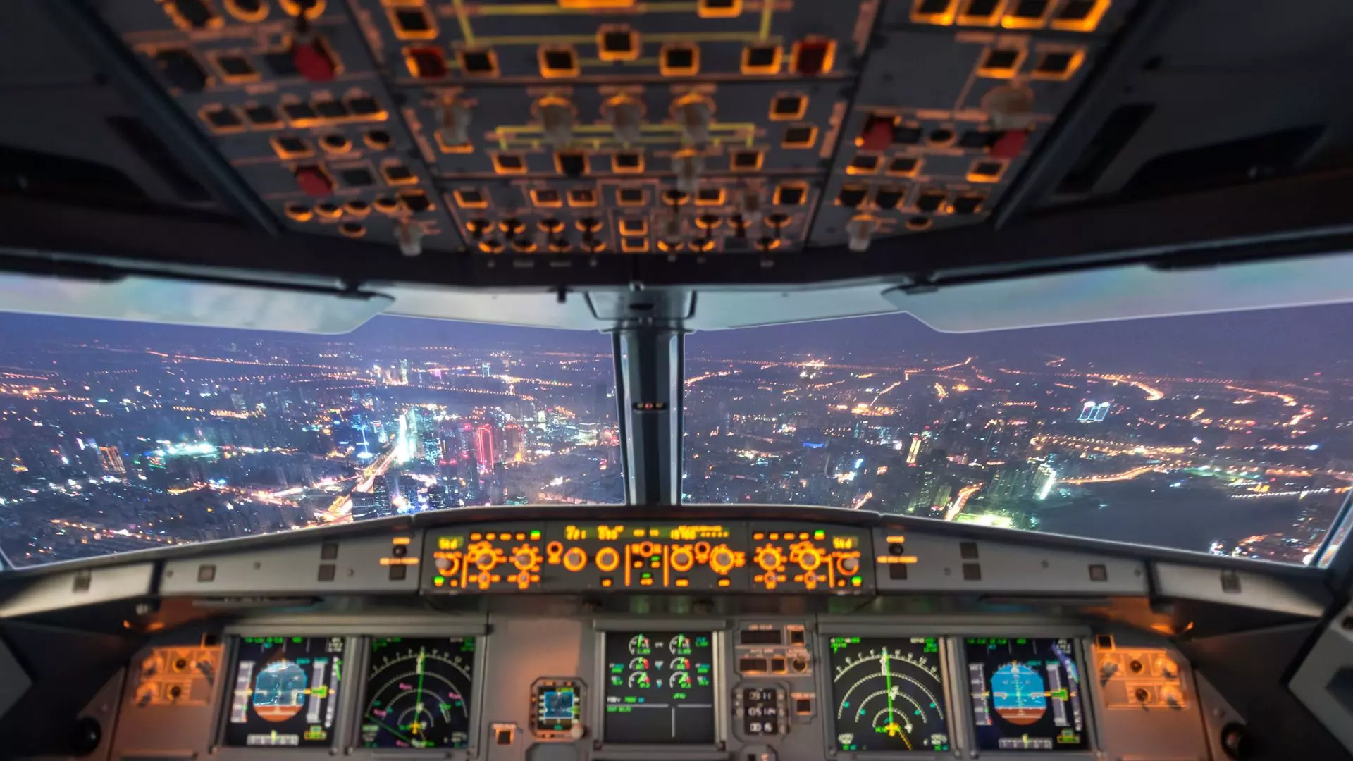 Switches in an airplane that have been wired using a complex wiring harness.